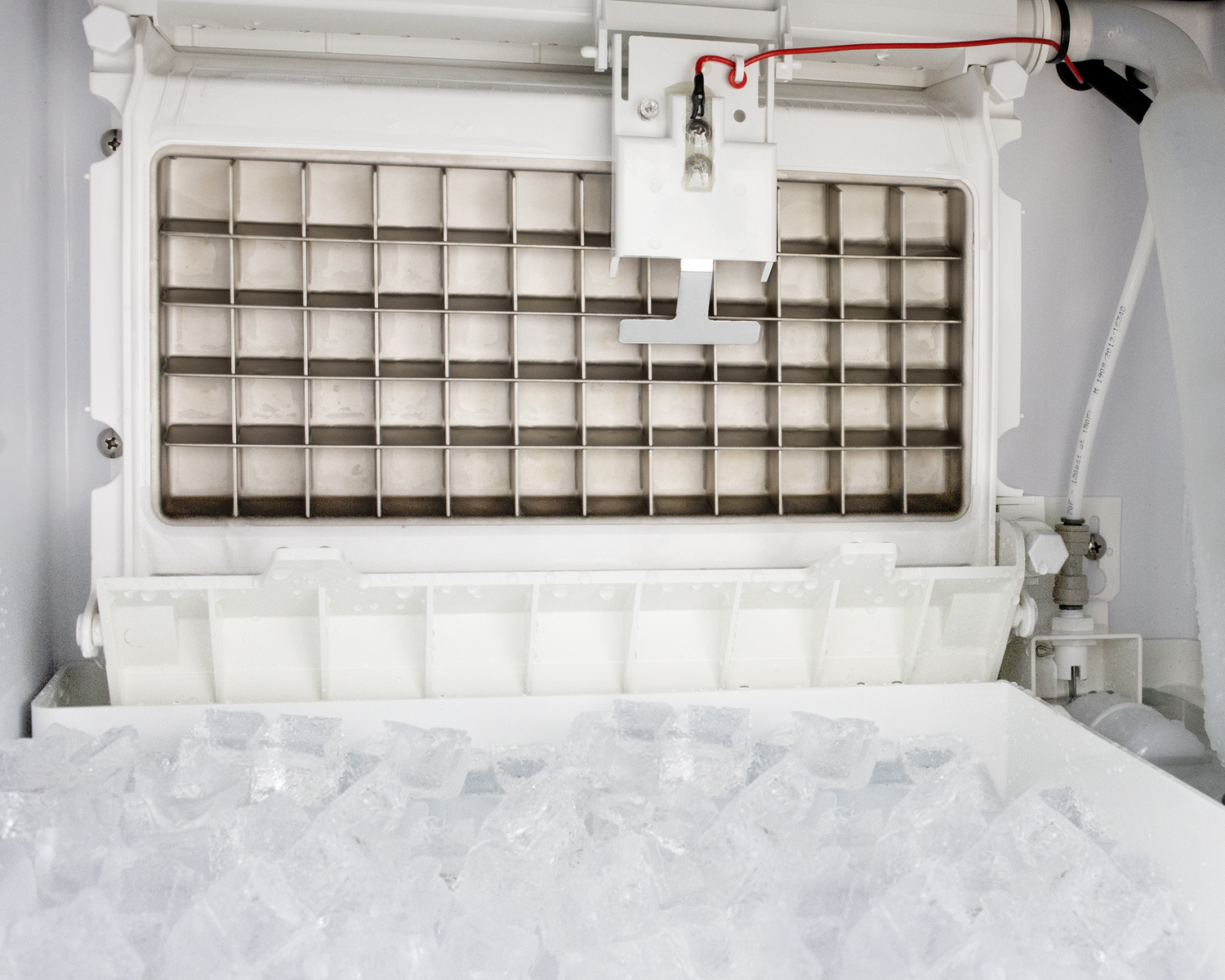 Commercially listed clear icemaker with 100 lb. ice production capacity for built-in or freestanding use